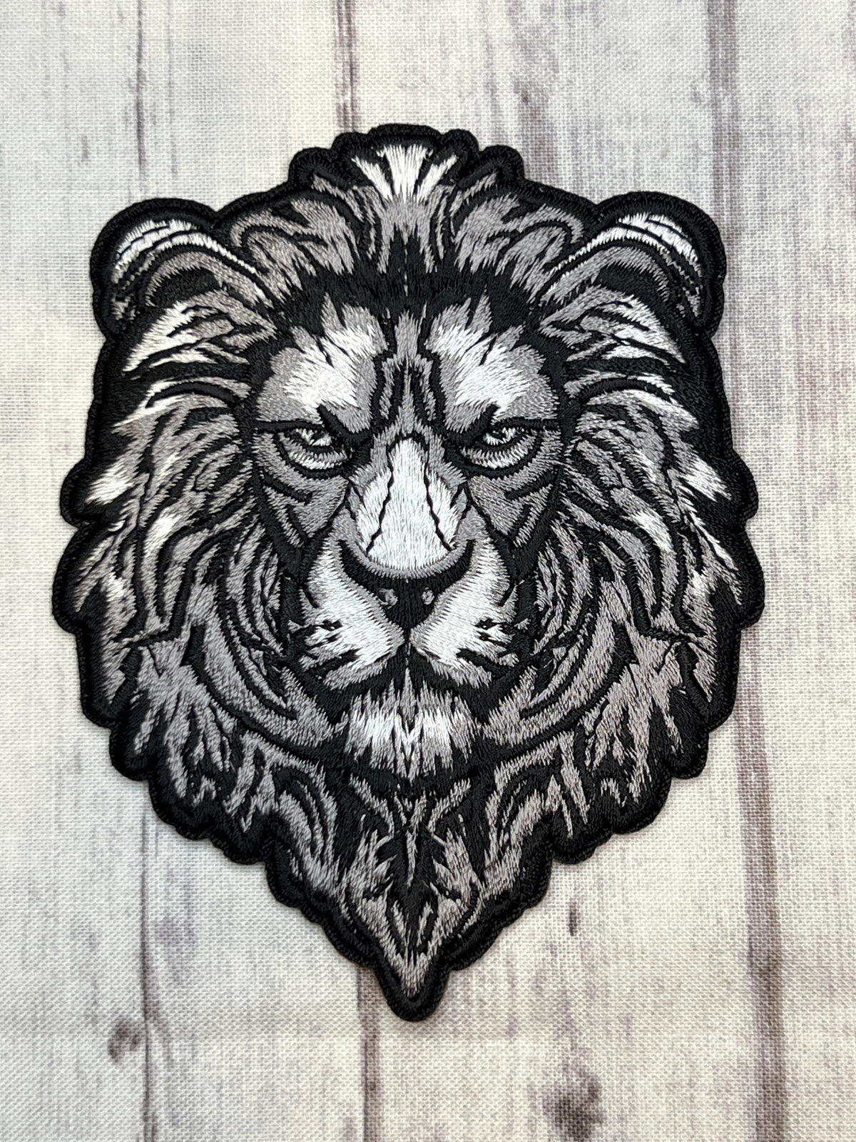 Silver lion iron on patch