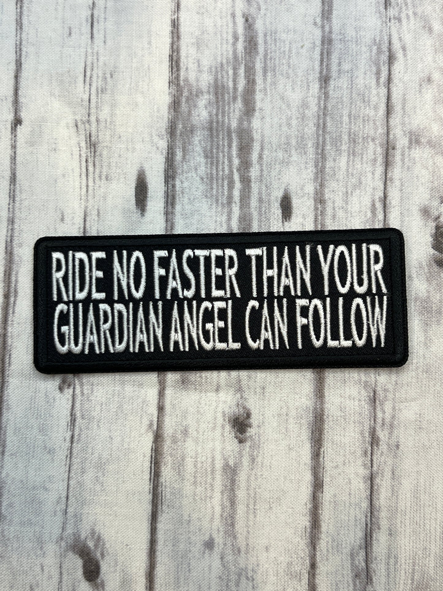 Ride no faster than your guardian angel can follow iron on patch