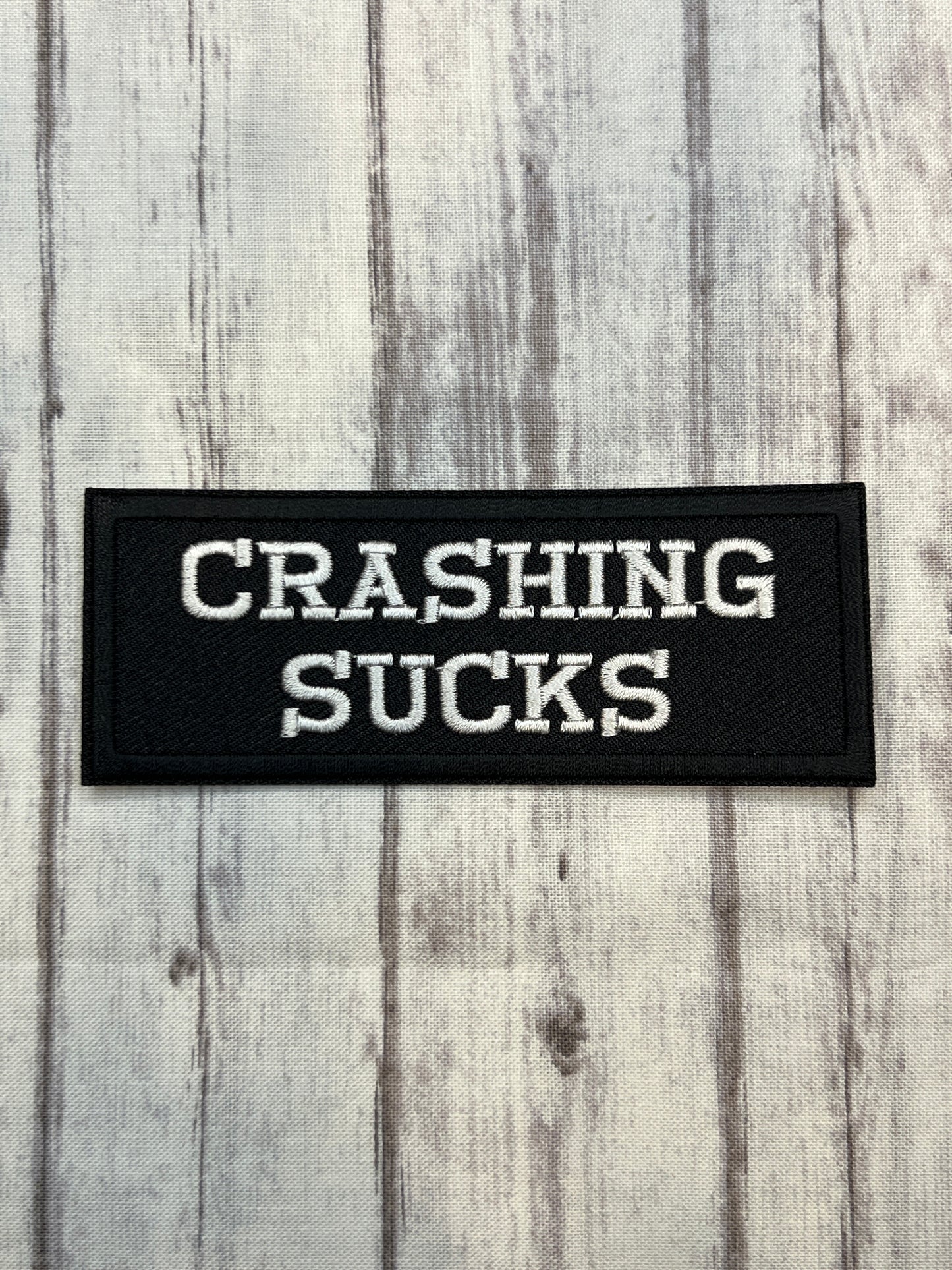Crashing sucks iron on patch